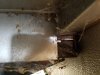 Exposed floor and view off exposed wall edge left side above wheels.jpg